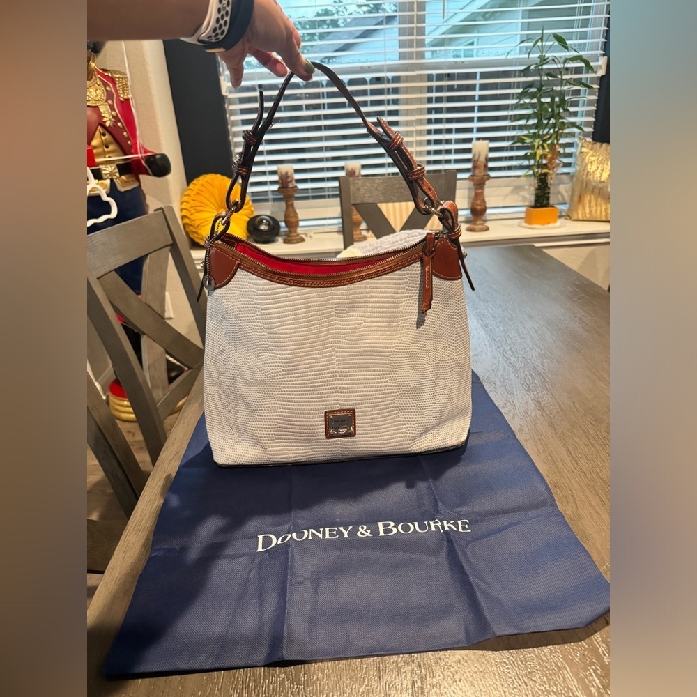 Dooney and Bourke gently used light blue shoulder hobo bag.​​